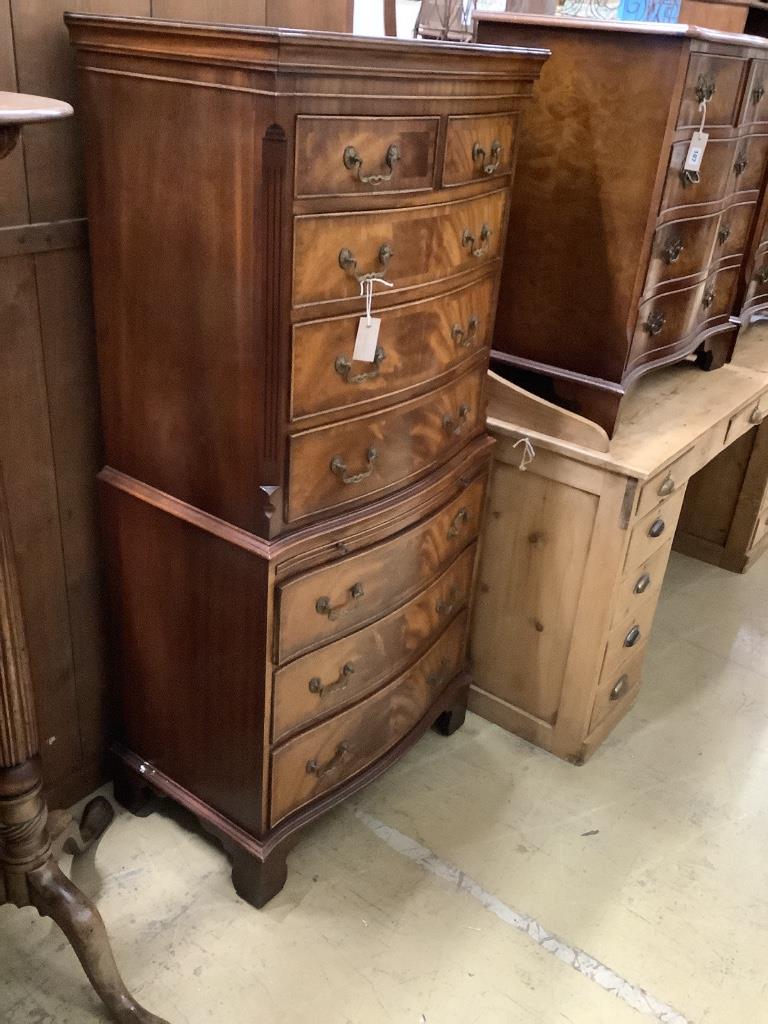 A reproduction George III style mahogany serpentine tallboy, width 72cm, depth 48cm, height 154cm